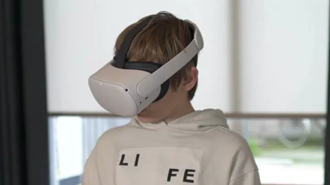 Boy playing with VR goggles Stock Footage 146289780