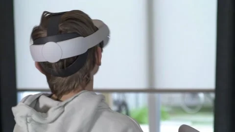 Boy playing with VR goggles slow-motion 1 Stock Footage 146289828