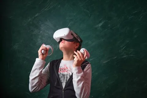 A boy playing with VR headset 스톡 사진