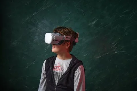 A boy playing with VR headset 스톡 사진