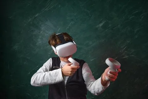 A boy playing with VR headset 스톡 사진