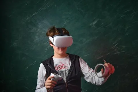 A boy playing with VR headset 스톡 사진