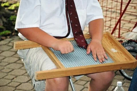 Boy playing a washboard Stock Photos