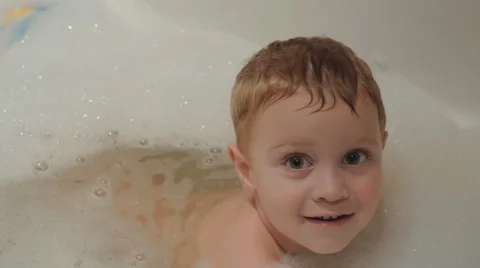 Boy playing in the water. 4K. Video stock 44404251