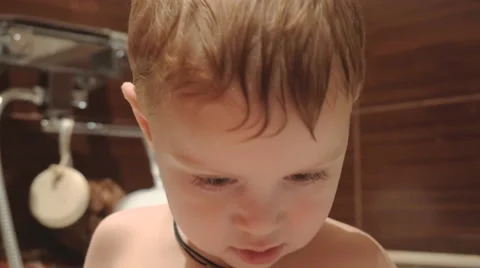 Boy playing in the water. 4K. Video stock 44404326