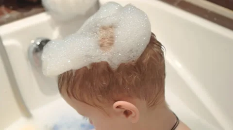 Boy playing in the water. 4K. Video stock 44404387