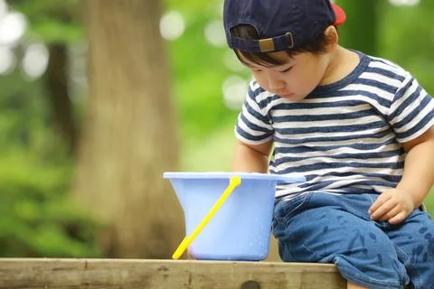 Boy playing in water Stock Photos