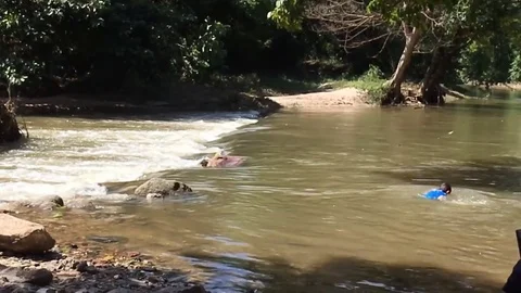 Boy playing Waterfall Video stock 83959708