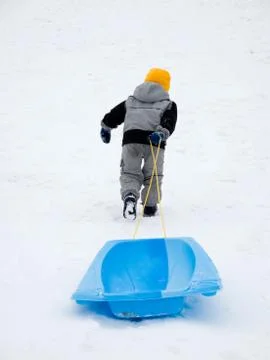 Boy playing in winter Stock Photos