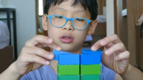 Boy playing wood block Stock Footage 75597535