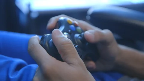 Boy playing xbox video game controller Stock Footage 104881020