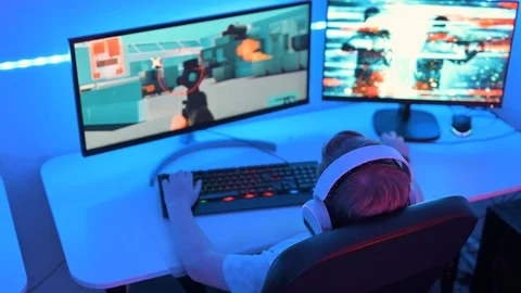 Boy plays action video game and takes target out Stock Footage 122507201