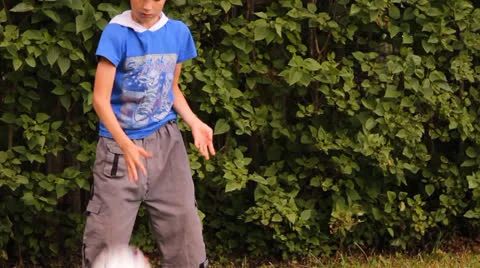 The boy plays a ball outdoors Stock Footage 25634760