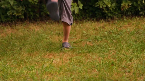 The boy plays a ball outdoors Stock Footage 25635280