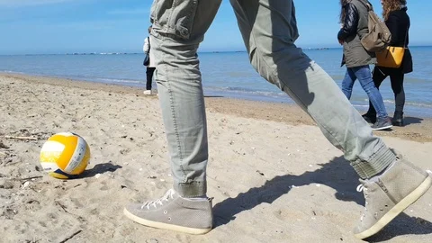 Boy plays with the ball on the shore Stock-Footage 88223495