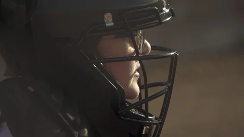 A boy plays catcher in a little league baseball game, super slow motion. Stock Footage