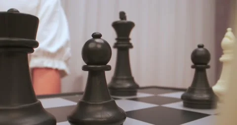 Boy plays chess. Chess figures extreme closeup. Stock Footage 223624700