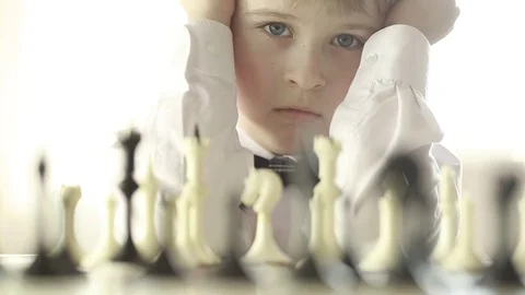  The boy plays chess Stock Footage 73336140