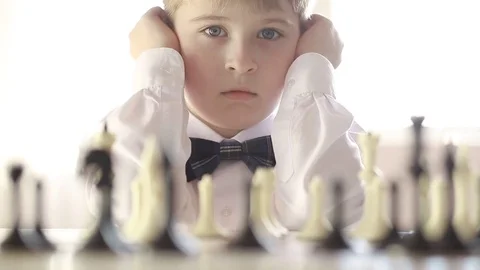  The boy plays chess Stock Footage 73336188