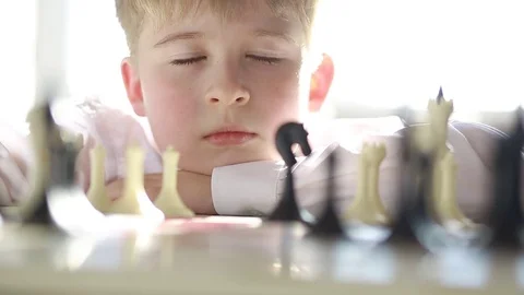 The boy plays chess Stock Footage 73336216