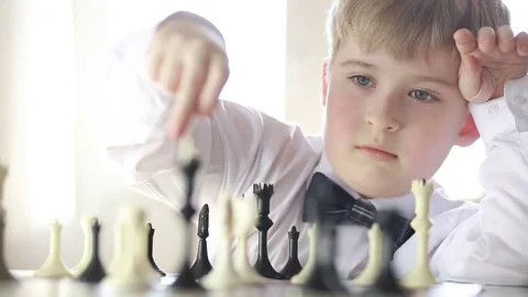 The boy plays chess Stock Footage 73336259