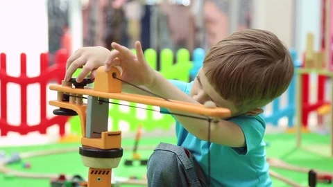 A boy plays on children's educational playground Stock Footage 76812550