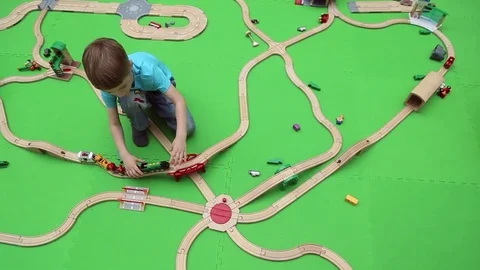 A boy plays on children's educational playground Stock Footage 76812984