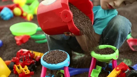 A boy plays on children's educational playground Stock Footage 76813289