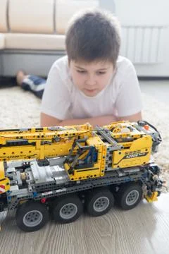 Boy plays collects from the constructor of  car Stock Photos