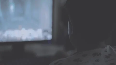 Boy plays computer game in the evening in pajamas Stock Footage 132186239