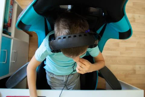 A boy plays in computer game Stock Photos