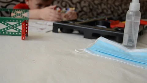 Boy plays constructor during covid-19 period on self-isolation Stock Footage 144476861