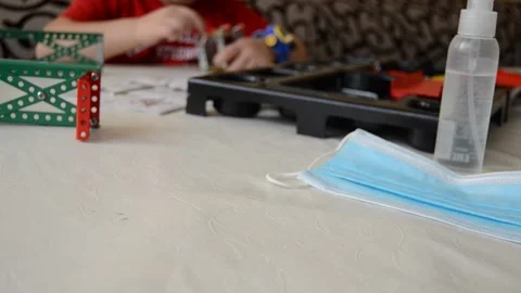 Boy plays constructor during covid-19 period on self-isolation Stock Footage 144489890