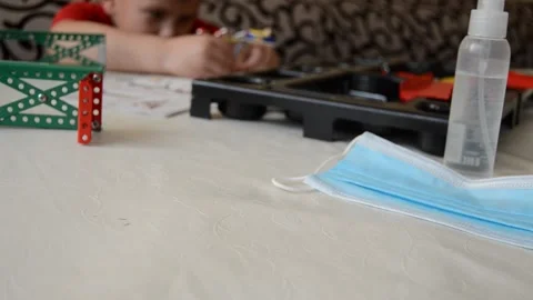 Boy plays constructor during covid-19 period on self-isolation Stock Footage 144490057