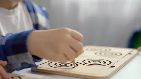 The boy plays a game that develops logic and hand motility. 스톡 동영상 243922676