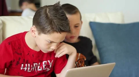 Boy plays game on laptop computer Video stock 40712350