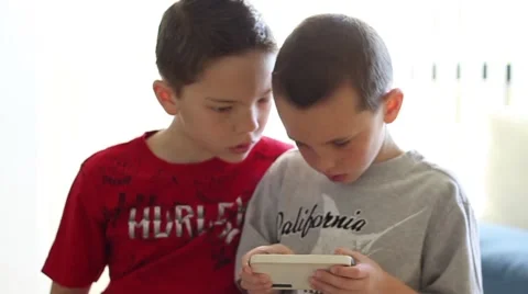 Boy plays game on smartphone Video stock 40712242
