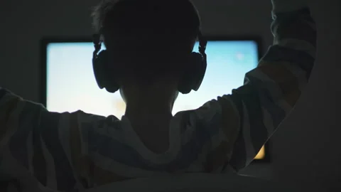 Boy plays game of War Thunder strategy online on computer Video stock 133202984