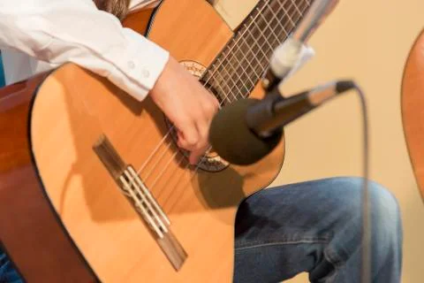 Boy plays guitar Stock Photos