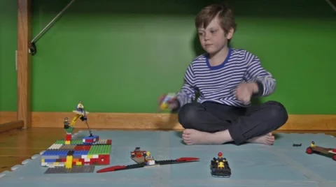 Boy plays with Lego Stock Footage 46969916