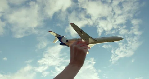 The boy plays as a model airplane Видео 154801039