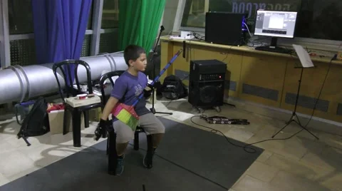 A boy plays music on a broom by using hand gestures recognized by computer  Stock Footage 67989273