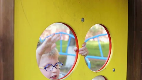 The boy plays in the playground Stock Footage 87907056