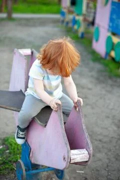 The boy plays in the playground Stock Photos