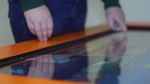 Boy plays in the race on the touch computer Stock Footage 81789269