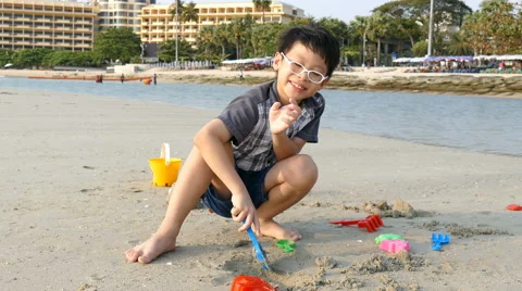 Boy Plays In The Sand On Beach Stock Footage 63327319