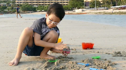 Boy Plays In The Sand On Beach Stock Footage 63327692