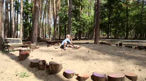 A boy plays in the sandbox Stock Footage 65154500