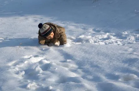 The boy plays to snow Stock Photos
