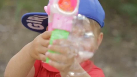 The boy plays with soap bubbles Stock Footage 76952638
